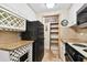 Kitchen features granite counters, white cabinets and pantry at 36750 Us Highway 19 N # 03127, Palm Harbor, FL 34684