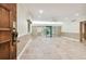 Living room with tile floors, sliding doors, and access to patio at 36750 Us Highway 19 N # 03127, Palm Harbor, FL 34684