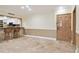 Living room with tile floors, kitchen bar and entryway at 36750 Us Highway 19 N # 03127, Palm Harbor, FL 34684