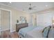 Bright bedroom with wood floors, a dresser, and a comfortable bed at 3942 14Th Ne St, St Petersburg, FL 33703