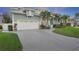 Two-story home with a three-car garage and landscaped yard at 3942 14Th Ne St, St Petersburg, FL 33703