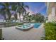 Relaxing pool and spa area with lounge chairs and lush landscaping at 3942 14Th Ne St, St Petersburg, FL 33703