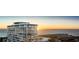 Highrise building exterior at sunset, showcasing balconies and ocean views at 400 Central Ave # 1201, St Petersburg, FL 33701