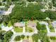 Discover the property's location, near pool and community features surrounded by mature trees at 514 Crestover Dr, Temple Terrace, FL 33617