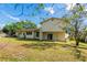Expansive backyard featuring a well-maintained lawn and plenty of room for outdoor activities at 514 Crestover Dr, Temple Terrace, FL 33617