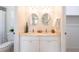 Bright bathroom with double sinks, granite countertop and white cabinets at 514 Crestover Dr, Temple Terrace, FL 33617