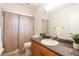 Well-lit bathroom with a vanity with a large mirror and granite countertops at 514 Crestover Dr, Temple Terrace, FL 33617