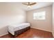 Cozy bedroom with wood floors, a twin bed, and a bright window at 514 Crestover Dr, Temple Terrace, FL 33617