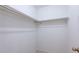 Empty walk-in closet with neutral walls, carpet, and a metal clothes rod at 514 Crestover Dr, Temple Terrace, FL 33617
