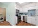 Updated kitchen with stainless steel appliances and blue tiled backsplash at 514 Crestover Dr, Temple Terrace, FL 33617
