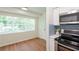 Eat-in kitchen featuring lots of natural light and modern appliances at 514 Crestover Dr, Temple Terrace, FL 33617