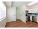 Modern kitchen with stainless steel appliances, white cabinets, and blue tile backsplash at 514 Crestover Dr, Temple Terrace, FL 33617