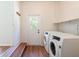 Laundry room featuring a washer, dryer and a door to the backyard at 514 Crestover Dr, Temple Terrace, FL 33617