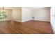 Bright and airy living room features new wood-look flooring and fresh neutral paint at 514 Crestover Dr, Temple Terrace, FL 33617