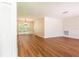 Open living space showcasing hardwood floors and natural light from large windows at 514 Crestover Dr, Temple Terrace, FL 33617