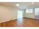 Spacious living room with new floors, ceiling fans and sliding glass doors to the backyard at 514 Crestover Dr, Temple Terrace, FL 33617