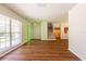 Spacious living area with new wood floors, staircase and ample natural light from a large window at 514 Crestover Dr, Temple Terrace, FL 33617