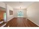 Bright living room featuring hardwood floors and a decorative light fixture at 514 Crestover Dr, Temple Terrace, FL 33617