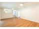 Spacious living room with new hardwood floors and stairs access at 514 Crestover Dr, Temple Terrace, FL 33617