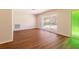 Bright living space featuring hardwood floors, fresh paint, and a view of the front yard at 514 Crestover Dr, Temple Terrace, FL 33617
