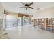 Large living room with exposed framing and new flooring at 5181 Horseshoe Ne Pl, St Petersburg, FL 33703