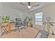 Home office with two desks, chairs, and a home gym machine at 555 Calico Scallop St, Ruskin, FL 33570