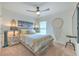 Charming bedroom with a queen-size bed, nightstands, and wall art at 555 Calico Scallop St, Ruskin, FL 33570