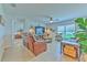 Relaxing living room with brown leather furniture and a large TV at 555 Calico Scallop St, Ruskin, FL 33570