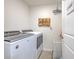 Bright laundry room with Whirlpool washer and dryer, and ample storage at 555 Calico Scallop St, Ruskin, FL 33570