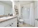 Simple bathroom with a tub, shower, and white vanity at 555 Calico Scallop St, Ruskin, FL 33570