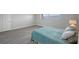 Simple bedroom with light teal bedding and good closet space at 6363 Gulf Winds Dr # 437, St Pete Beach, FL 33706