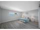 Spacious bedroom with light teal bedding and plenty of closet space at 6363 Gulf Winds Dr # 437, St Pete Beach, FL 33706