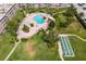 Enjoy the community's lush landscaping, shimmering pool, and shuffleboard courts from above at 6363 Gulf Winds Dr # 437, St Pete Beach, FL 33706