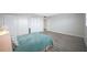 Cozy bedroom with light teal bedding and good closet space at 6363 Gulf Winds Dr # 437, St Pete Beach, FL 33706