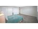 Comfortable bedroom with ample closet space, neutral decor, and durable gray flooring, perfect for relaxation at 6363 Gulf Winds Dr # 437, St Pete Beach, FL 33706