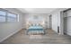 Inviting bedroom featuring neutral walls, stylish decor, and modern gray flooring, providing a serene space at 6363 Gulf Winds Dr # 437, St Pete Beach, FL 33706
