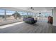 Bright living room with city views, hardwood floors, and modern furniture at 6363 Gulf Winds Dr # 437, St Pete Beach, FL 33706