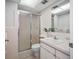 Updated bathroom with a walk-in shower, modern vanity, and fresh tile at 6363 Gulf Winds Dr # 437, St Pete Beach, FL 33706