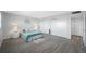 Bright bedroom with light teal bedding and plenty of closet space at 6363 Gulf Winds Dr # 437, St Pete Beach, FL 33706