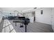 Elegant living room featuring a grand piano and hardwood floors at 6363 Gulf Winds Dr # 437, St Pete Beach, FL 33706