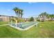 Shuffleboard court with benches in a lush green area at 6363 Gulf Winds Dr # 437, St Pete Beach, FL 33706