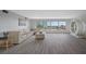 Comfortable living room with sectional sofa and hardwood floors at 6363 Gulf Winds Dr # 437, St Pete Beach, FL 33706