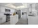 Modern kitchen featuring stainless steel appliances, white cabinetry, and a functional layout at 6363 Gulf Winds Dr # 437, St Pete Beach, FL 33706