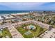 Aerial view of building, pool, and ocean at 6363 Gulf Winds Dr # 437, St Pete Beach, FL 33706