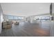 Spacious living room with hardwood floors and modern furniture at 6363 Gulf Winds Dr # 437, St Pete Beach, FL 33706