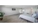 Spacious bedroom with hardwood floors and en-suite bathroom at 6363 Gulf Winds Dr # 437, St Pete Beach, FL 33706