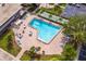 Community pool with lounge chairs and tables at 6363 Gulf Winds Dr # 437, St Pete Beach, FL 33706