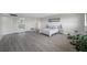 Well-lit bedroom with hardwood floors and mirrored closet at 6363 Gulf Winds Dr # 437, St Pete Beach, FL 33706