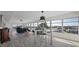 Living room features hardwood floors, large windows and city views at 6363 Gulf Winds Dr # 437, St Pete Beach, FL 33706