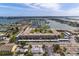 Aerial view of waterfront condo with parking and green space at 6363 Gulf Winds Dr # 437, St Pete Beach, FL 33706